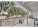 Wide balcony providing views of the golf course and palm tree-lined landscape at 263 Sea Cloud Cir, Edisto Island, SC 29438