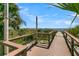 Convenient beach access with shower and wooden walkway leading to the ocean and sandy shores at 263 Sea Cloud Cir, Edisto Island, SC 29438