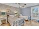 Charming bedroom with a ceiling fan, natural light, and floral wallpaper at 263 Sea Cloud Cir, Edisto Island, SC 29438