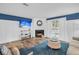 Bright living room featuring a fireplace, a TV, and a sliding glass door to the outside at 263 Sea Cloud Cir, Edisto Island, SC 29438