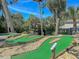 Enjoy Gathering fun at the charming community mini-golf course, surrounded by lush greenery and mature trees at 263 Sea Cloud Cir, Edisto Island, SC 29438