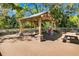 Spacious wooden deck featuring a shaded pavilion with picnic tables, perfect for outdoor gatherings and relaxation at 263 Sea Cloud Cir, Edisto Island, SC 29438