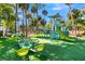 Wonderful community playground with modern play structures, a rocking horse, and soft turf, promising hours of fun at 263 Sea Cloud Cir, Edisto Island, SC 29438