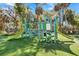 Inviting community playground with vibrant play structures and soft turf, offering fun for in a safe environment at 263 Sea Cloud Cir, Edisto Island, SC 29438