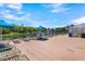 Community pool deck area with lounge chairs, lake views, and blue umbrellas for shade at 263 Sea Cloud Cir, Edisto Island, SC 29438