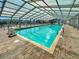 Indoor community pool featuring a retractable roof for year-round use with tiled pool deck at 263 Sea Cloud Cir, Edisto Island, SC 29438
