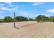 Outdoor sand volleyball court surrounded by vegetation and houses in the background at 263 Sea Cloud Cir, Edisto Island, SC 29438