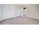 This bedroom features carpet, neutral walls and offers ample storage with 3 large closets at 2641 Woodlawn Ave, North Charleston, SC 29405