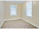 Bedroom with neutral walls, wall to wall carpet and ample natural light at 2641 Woodlawn Ave, North Charleston, SC 29405