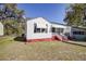 Side view of a cozy, one-story home with a well-maintained lawn and inviting curb appeal at 2641 Woodlawn Ave, North Charleston, SC 29405
