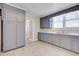Spacious kitchen with painted cabinets, ample counter space, and wood-look flooring at 2641 Woodlawn Ave, North Charleston, SC 29405