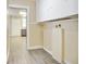 Laundry area featuring new flooring, cabinets, and laundry hookups at 2641 Woodlawn Ave, North Charleston, SC 29405