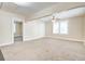Open living room featuring new carpet, neutral walls and ceiling, and bright windows at 2641 Woodlawn Ave, North Charleston, SC 29405