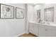 Bright bathroom featuring double sinks, white cabinets, and modern fixtures, offering style and convenience at 268 Watersglen Dr, Summerville, SC 29486