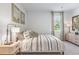 Cozy bedroom featuring a beautifully decorated bed, a window, and tasteful decor at 268 Watersglen Dr, Summerville, SC 29486
