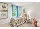 A boho-themed bedroom is decorated with elephant art, a dreamcatcher, and a colorful bohemian-print bedspread at 268 Watersglen Dr, Summerville, SC 29486