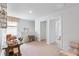 A hallway is decorated with a desk and seating area at the top of the stairs near the home's bedrooms at 268 Watersglen Dr, Summerville, SC 29486