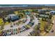 Aerial view of golf course, tennis courts, community pool, club house, and parking at 2722 Crooked Stick Ln, Mount Pleasant, SC 29466