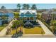 Beautifully landscaped home with a metal roof and inviting front porch in a lush neighborhood at 2722 Crooked Stick Ln, Mount Pleasant, SC 29466