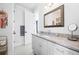 Well-lit bathroom featuring a vanity with granite countertops and white cabinets and updated fixtures at 2722 Crooked Stick Ln, Mount Pleasant, SC 29466
