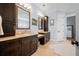 Well-lit bathroom with dark cabinets, double sinks, and ample storage space at 2722 Crooked Stick Ln, Mount Pleasant, SC 29466