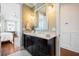 Bathroom showcasing granite countertop, updated fixtures, and a glimpse into the bedroom suite at 2722 Crooked Stick Ln, Mount Pleasant, SC 29466