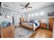 Cozy bedroom with wood floors, blue accents, and neutral walls, creating a relaxing retreat at 2722 Crooked Stick Ln, Mount Pleasant, SC 29466