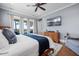 Serene bedroom with blue walls, wood furniture, and a private balcony offering scenic views at 2722 Crooked Stick Ln, Mount Pleasant, SC 29466