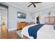 Comfortable bedroom with light walls, hard wood floors, TV, and dresser at 2722 Crooked Stick Ln, Mount Pleasant, SC 29466