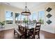 Well-lit dining room with wood furniture and a view of the outdoors at 2722 Crooked Stick Ln, Mount Pleasant, SC 29466