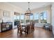 Bright dining area with large windows and modern lighting, providing a relaxing space at 2722 Crooked Stick Ln, Mount Pleasant, SC 29466