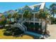 Charming coastal home with a welcoming front porch and professional landscaping in a desirable neighborhood at 2722 Crooked Stick Ln, Mount Pleasant, SC 29466