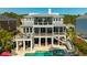 Rear exterior showcasing the deck, patio, and swimming pool at 2722 Crooked Stick Ln, Mount Pleasant, SC 29466