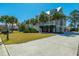 Beautifully landscaped home with a welcoming front porch and wide driveway on a sunny day at 2722 Crooked Stick Ln, Mount Pleasant, SC 29466