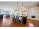 Open-concept kitchen with a large island and seating, seamlessly flowing into the dining area at 2722 Crooked Stick Ln, Mount Pleasant, SC 29466