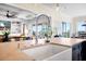 Stylish kitchen island with a sink and views of the living room at 2722 Crooked Stick Ln, Mount Pleasant, SC 29466