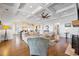 Open-concept living room with fireplace, coffered ceiling, hardwood floors, and view to kitchen at 2722 Crooked Stick Ln, Mount Pleasant, SC 29466