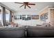 Media room featuring large comfy couches, multiple TV screens, custom built ins, and a cozy vibe at 2722 Crooked Stick Ln, Mount Pleasant, SC 29466