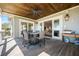 Spacious patio with a wood ceiling, dining furniture, BBQ and comfortable outdoor lounge area at 2722 Crooked Stick Ln, Mount Pleasant, SC 29466