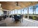 Covered patio boasts wood ceiling, outdoor table, four chairs, and scenic views beyond at 2722 Crooked Stick Ln, Mount Pleasant, SC 29466
