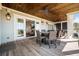 Open patio with dark wood ceiling, dining table, and outdoor lounge furniture at 2722 Crooked Stick Ln, Mount Pleasant, SC 29466