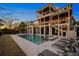 Exterior view of pool and outdoor lounge area at dusk at 2722 Crooked Stick Ln, Mount Pleasant, SC 29466