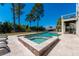 Lovely in-ground pool and spa with travertine patio, lounge chairs, and landscaped backyard at 2722 Crooked Stick Ln, Mount Pleasant, SC 29466