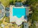 Aerial view of a community pool and playground with lounge chairs for relaxing by the clear blue water at 2722 Crooked Stick Ln, Mount Pleasant, SC 29466