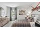 Decorated bedroom with neutral walls, plaid bedding, bedside tables, and hockey themed decor, creating inviting aesthetic at 280 Watersglen Dr, Summerville, SC 29486