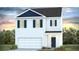 Charming two-story home with a white exterior, blue shutters, and a well-manicured lawn at 280 Watersglen Dr, Summerville, SC 29486