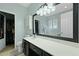A bathroom with a white countertop vanity, large mirror, and an enclosed closet area at 3438 Farmers Market Dr, Charleston, SC 29414