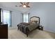 Spacious bedroom features a vaulted ceiling, large bed with tufted headboard, and ceiling fan at 3438 Farmers Market Dr, Charleston, SC 29414
