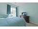 This bedroom has blue bedding, carpet, and an adjacent dark wood dresser at 3438 Farmers Market Dr, Charleston, SC 29414
