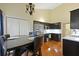 Eat-in kitchen with stainless steel appliances, dark wood cabinets, and an adjacent dining area at 3438 Farmers Market Dr, Charleston, SC 29414